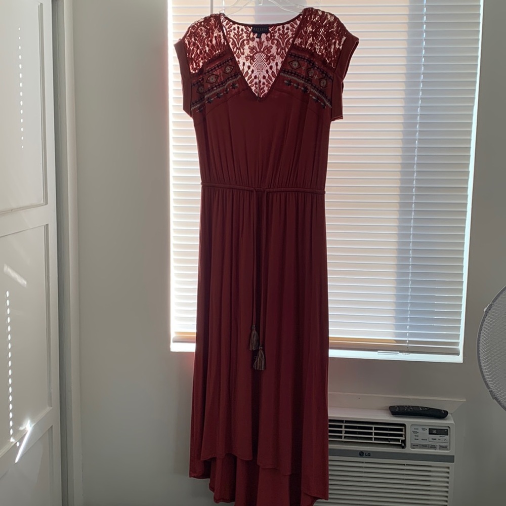 Brand new with tag. This dress is cute with lace and brick in color